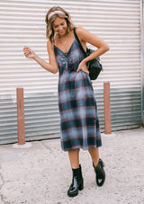[Color: Dusty Blue] Throw it back to the nineties with our effortlessly chic and easy plaid midi dress. Made from one hundred percent cotton, this tank top dress features a flattering v neckline with front button detail and breezy side slits for movement. Styled here with a mini backpack and boots.