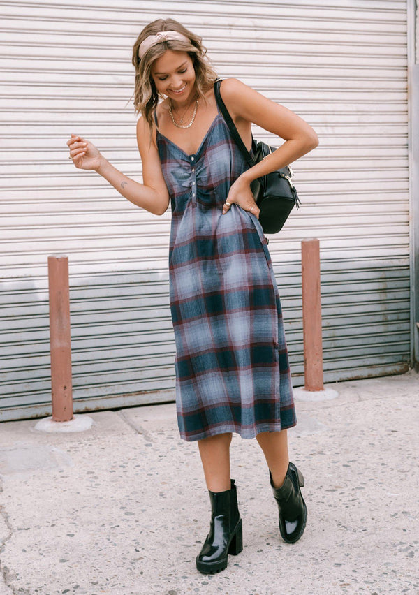 [Color: Dusty Blue] Throw it back to the nineties with our effortlessly chic and easy plaid midi dress. Made from one hundred percent cotton, this tank top dress features a flattering v neckline with front button detail and breezy side slits for movement. Styled here with a mini backpack and boots.