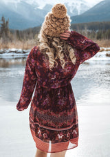 [Color: Wine Spice] A romantic bohemian floral print mini dress. Featuring an empire waist with an adjustable drawstring, voluminous long sleeves, and a flattering v neckline. 