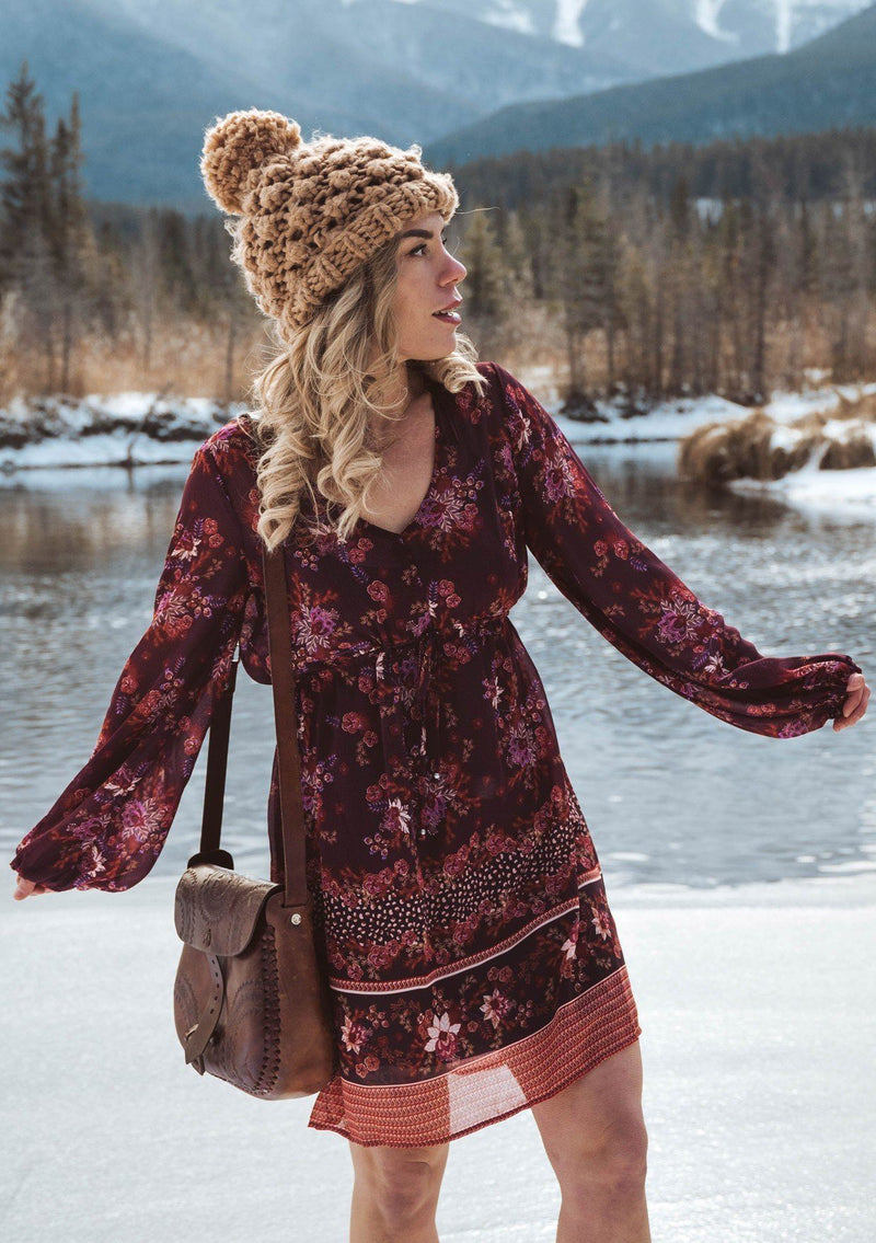 [Color: Wine Spice] A romantic bohemian floral print mini dress. Featuring an empire waist with an adjustable drawstring, voluminous long sleeves, and a flattering v neckline. 