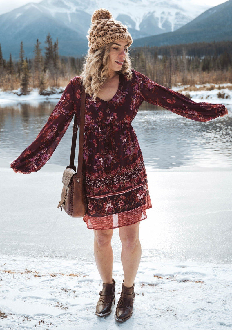[Color: Wine Spice] A romantic bohemian floral print mini dress. Featuring an empire waist with an adjustable drawstring, voluminous long sleeves, and a flattering v neckline. 