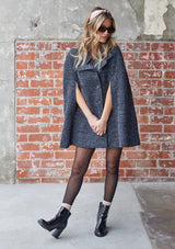 [Color: Charcoal] A double breasted cape coat. Featuring a chic flyaway silhouette and a soft marled texture. 