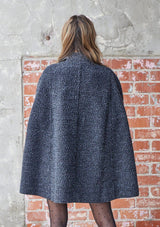 [Color: Charcoal] A double breasted cape coat. Featuring a chic flyaway silhouette and a soft marled texture. 