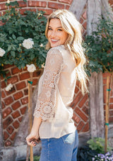 [Color: Stone] Bohemian flowy top featuring pretty crochet bell sleeves and a crochet neckline detail.