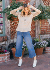 [Color: Stone] Bohemian flowy top featuring pretty crochet bell sleeves and a crochet neckline detail.