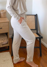 [Color: Heather Stone] Girl wearing cozy natural lounge bottoms.