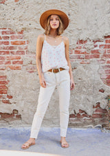 [Color: Ivory/Coral] Girl wearing a white polka dot lace trim tank.