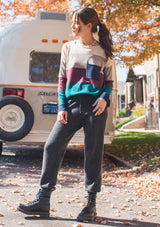 [Color: Heather Eclipse] A bold color block striped knit sweater, featuring a contrast front pocket, a wide crew neckline, and an easy, relaxed fit. Perfectly soft and cozy, this lightweight pullover looks great styled with denim or as shown here with woolly joggers. 