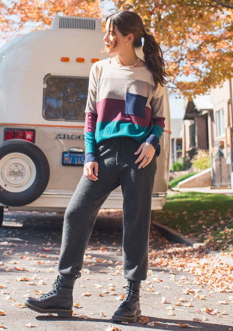 [Color: Heather Eclipse] A bold color block striped knit sweater, featuring a contrast front pocket, a wide crew neckline, and an easy, relaxed fit. Perfectly soft and cozy, this lightweight pullover looks great styled with denim or as shown here with woolly joggers. 