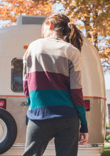 [Color: Heather Eclipse] A bold color block striped knit sweater, featuring a contrast front pocket, a wide crew neckline, and an easy, relaxed fit. Perfectly soft and cozy, this lightweight pullover looks great styled with denim or as shown here with woolly joggers. 