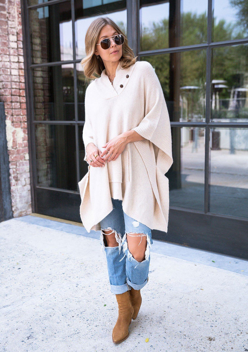 [Color: Oatmeal] Super soft knit sweater poncho. Featuring a shawl collar neckline with functional shank buttons, a front kangaroo pocket, and contrast ribbed trim. 