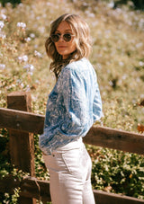 [Color: Chambray] Our soft, vintage style chambray button up shirt in a dreamy bleached out check print features two front patch pockets with a button flap closure, a snap button up front, and a western style yoke. 