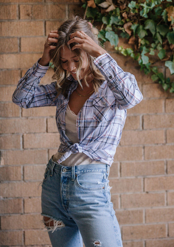 [Color: Blue/Red] Lighten up your wardrobe with our soft, washed button up shirt in a dreamy light blue plaid print. Featuring two front patch pockets with a button flap closure, a snap button up front, and a western style yoke.