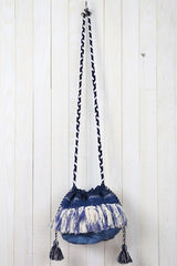 [Color: Navy] An image of a blue boho crossbody bag with fringe and tassels.  
