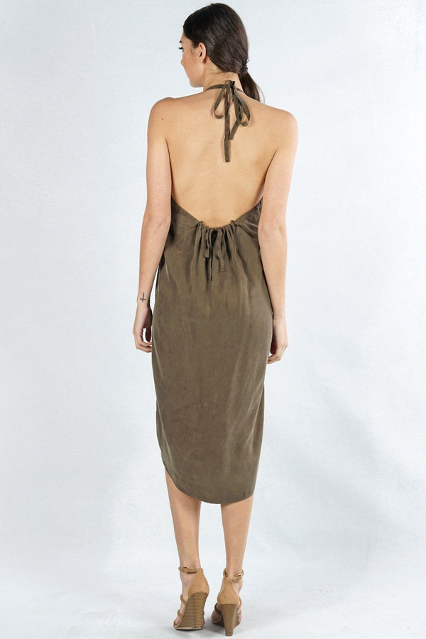 [Color: Olive] A back facing image of a brunette model wearing an olive green high-low halter dress featuring a v-neckline, open back, side pockets, and an adjustable drawstring tie at the back for a chic finish.