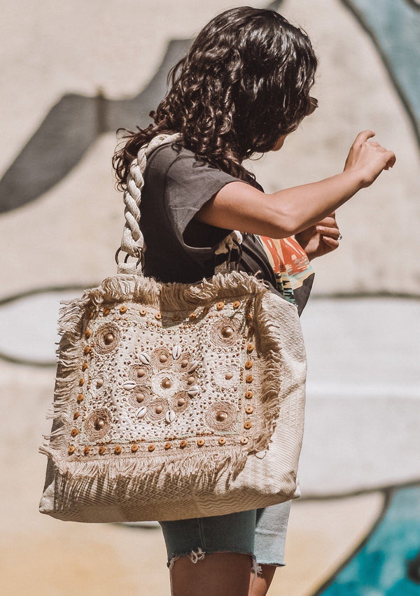 [Color: Natural] Girl carrying a boho beach tote.