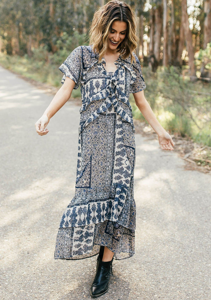 [Color: Navy/Sky] Lovestitch navy/sky floral paisley printed, flutter sleeve maxi dress with tiered, ruffled detail.