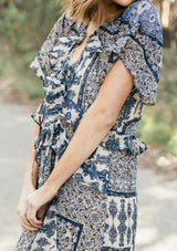 [Color: Navy/Sky] Lovestitch navy/sky floral paisley printed, flutter sleeve maxi dress with tiered, ruffled detail.