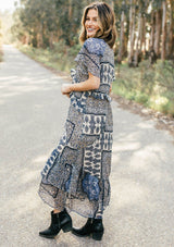 [Color: Navy/Sky] Lovestitch navy/sky floral paisley printed, flutter sleeve maxi dress with tiered, ruffled detail.