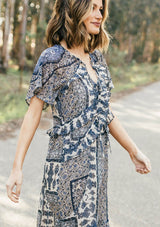 [Color: Navy/Sky] Lovestitch navy/sky floral paisley printed, flutter sleeve maxi dress with tiered, ruffled detail.
