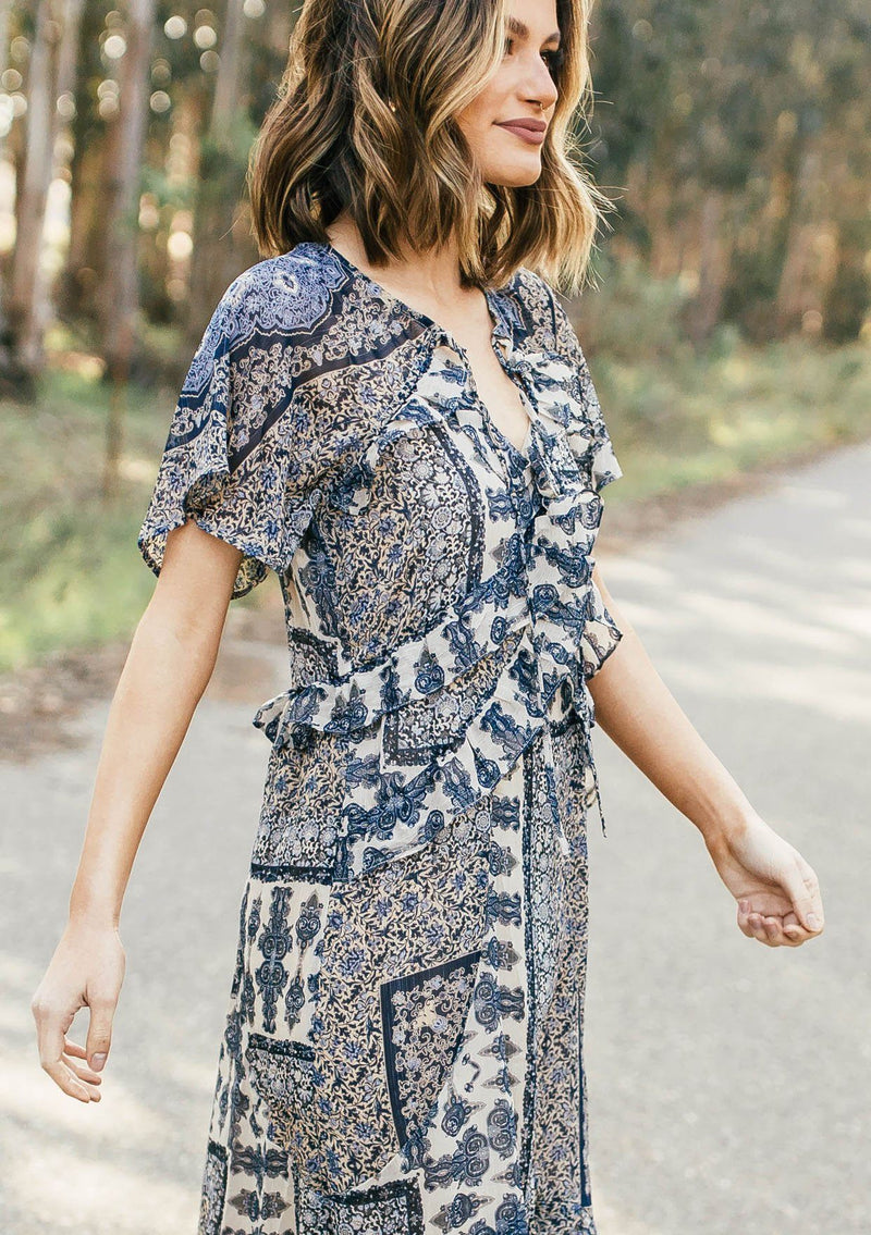 [Color: Navy/Sky] Lovestitch navy/sky floral paisley printed, flutter sleeve maxi dress with tiered, ruffled detail.
