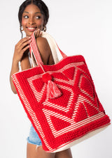 [Color: Red] An oversize red bohemian carpet tote bag.