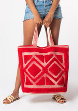 [Color: Red] An oversize red bohemian carpet tote bag.