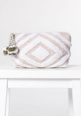 [Color: White/Taupe] A white and taupe bohemian carpet makeup bag with pom tassel. 