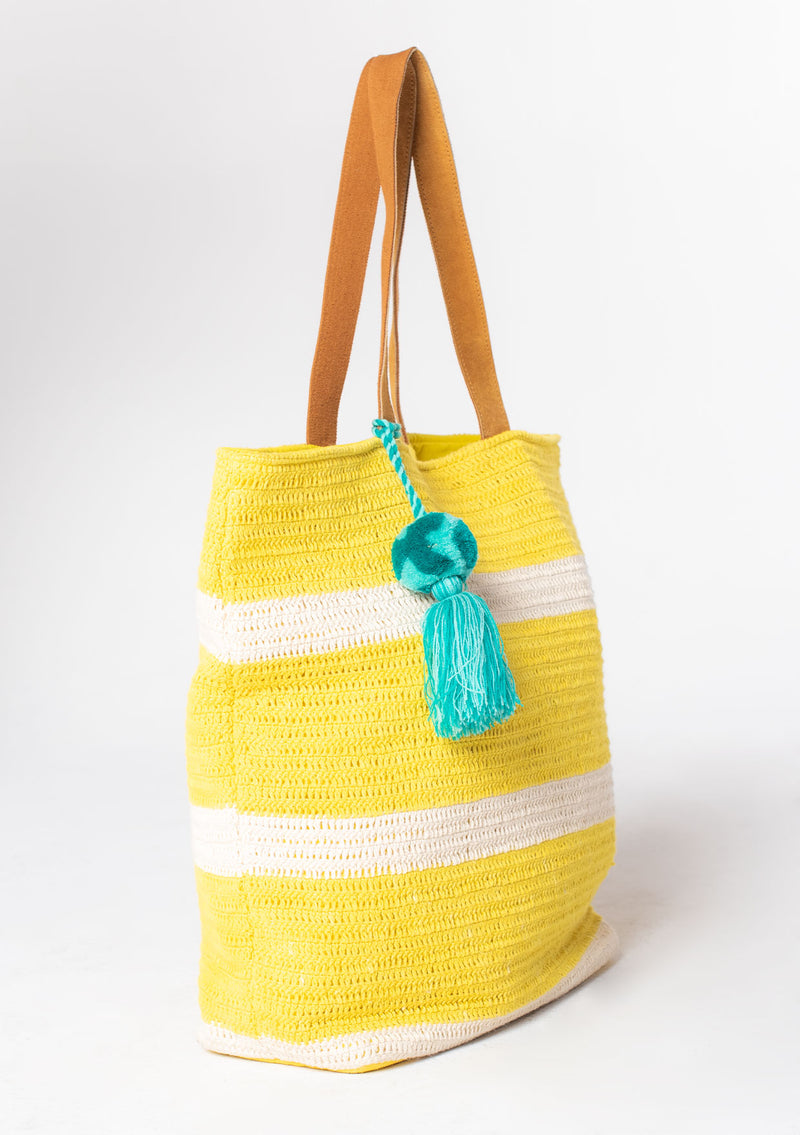 [Color: Yellow/Natural] Bohemian yellow stripe beach tote bag in cotton crochet knit, with suede leather handles and an oversize tassel accent. 