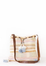 [Color: Natural Multi] An ultra bohemian drawstring tote bag in a striped canvas. Featuring a drawstring top, snap closure, and long leather strap.