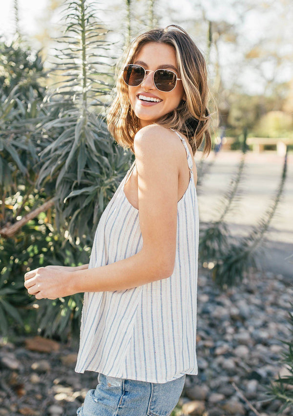 [Color: Natural/Red] A breezy Summer tank top in yarn dye stripes. With a button front, adjustable spaghetti straps, and a v neckline in front and back.