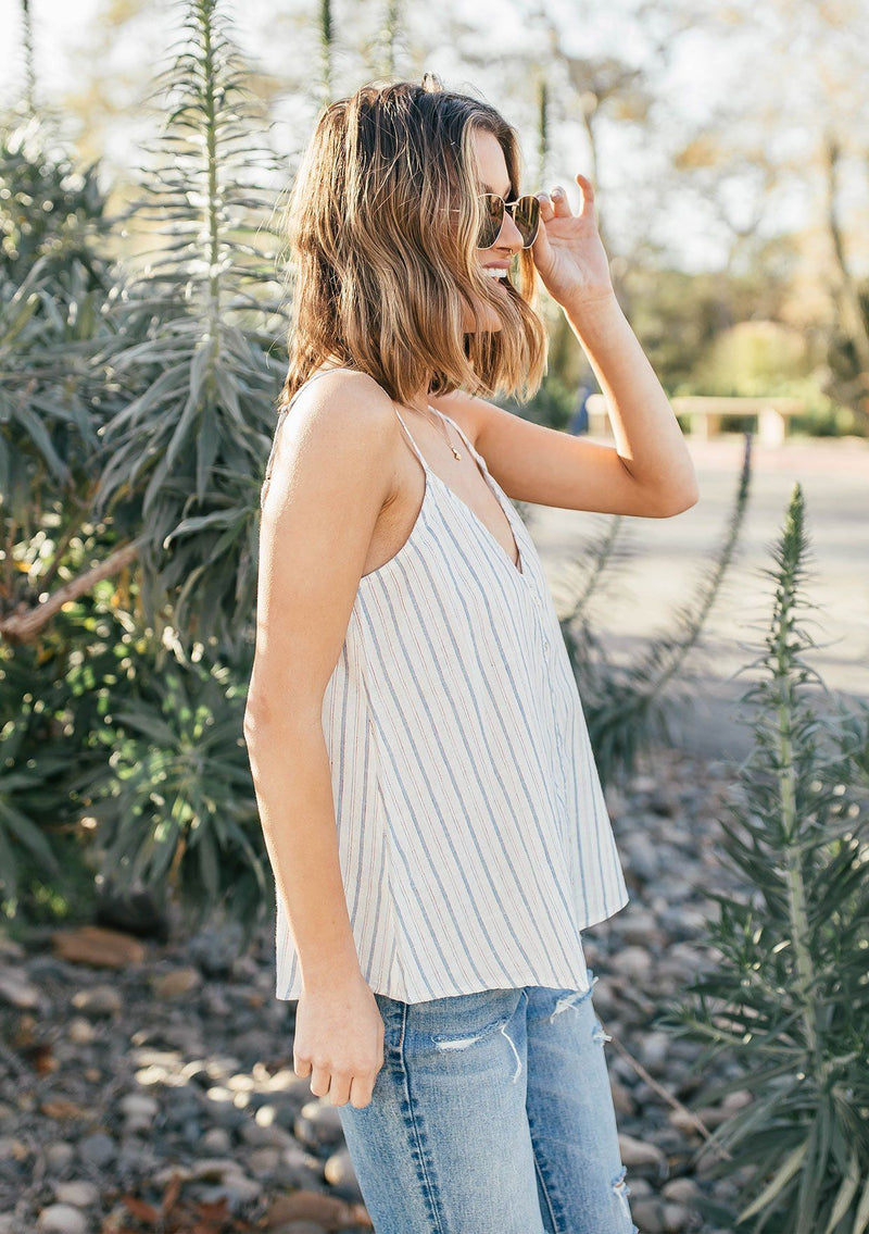 [Color: Natural/Red] A breezy Summer tank top in yarn dye stripes. With a button front, adjustable spaghetti straps, and a v neckline in front and back.