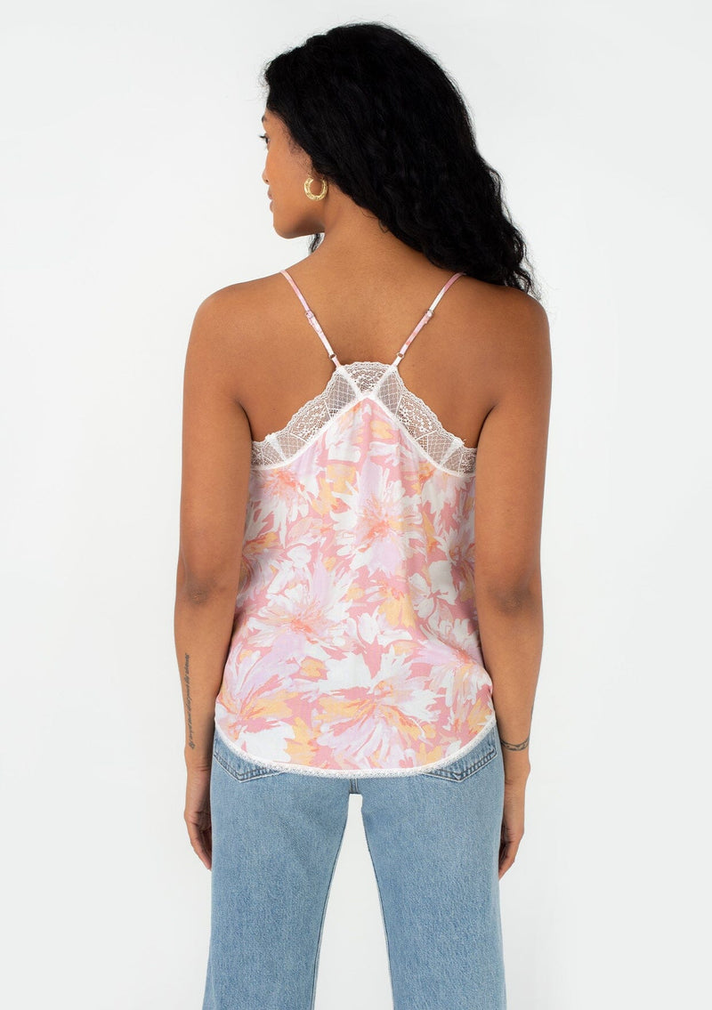 [Color: Peach/Light Pink] A back facing image of a brunette model wearing a best selling lace trim camisole in a pink floral print. With adjustable spaghetti straps, a racer back, and a v neckline. 
