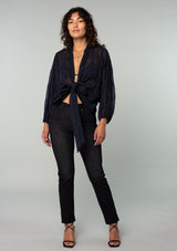 [Color: Navy] A full body front facing image of a brunette model wearing a navy blue bohemian embroidered chiffon kimono top. With long sleeves and a tie front that can be styled in multiple ways. 