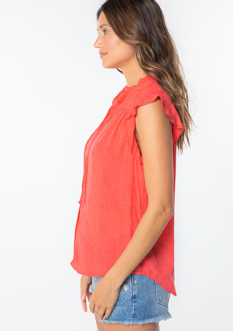 [Color: Hot Coral] A model wearing the best selling coral short flutter sleeve button front bohemian top in a floral jacquard.