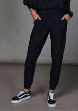 [Color: Black] Relaxed, super soft jogger pants with cool distressed details. Featuring essential side pockets, a slightly tapered leg, and an elastic waistband.
