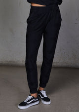 [Color: Black] Relaxed, super soft jogger pants with cool distressed details. Featuring essential side pockets, a slightly tapered leg, and an elastic waistband.