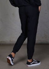 [Color: Black] Relaxed, super soft jogger pants with cool distressed details. Featuring essential side pockets, a slightly tapered leg, and an elastic waistband.