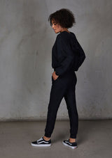 [Color: Black] Relaxed, super soft jogger pants with cool distressed details. Featuring essential side pockets, a slightly tapered leg, and an elastic waistband.
