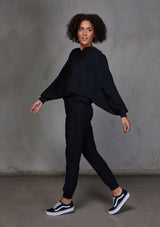 [Color: Black] Relaxed, super soft jogger pants with cool distressed details. Featuring essential side pockets, a slightly tapered leg, and an elastic waistband.