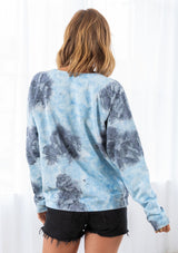 [Color: Sky Blue/Grey Combo] A model wearing a blue and grey cotton tie dye sweatshirt. Featuring a classic crew neckline and long raglan sleeves.