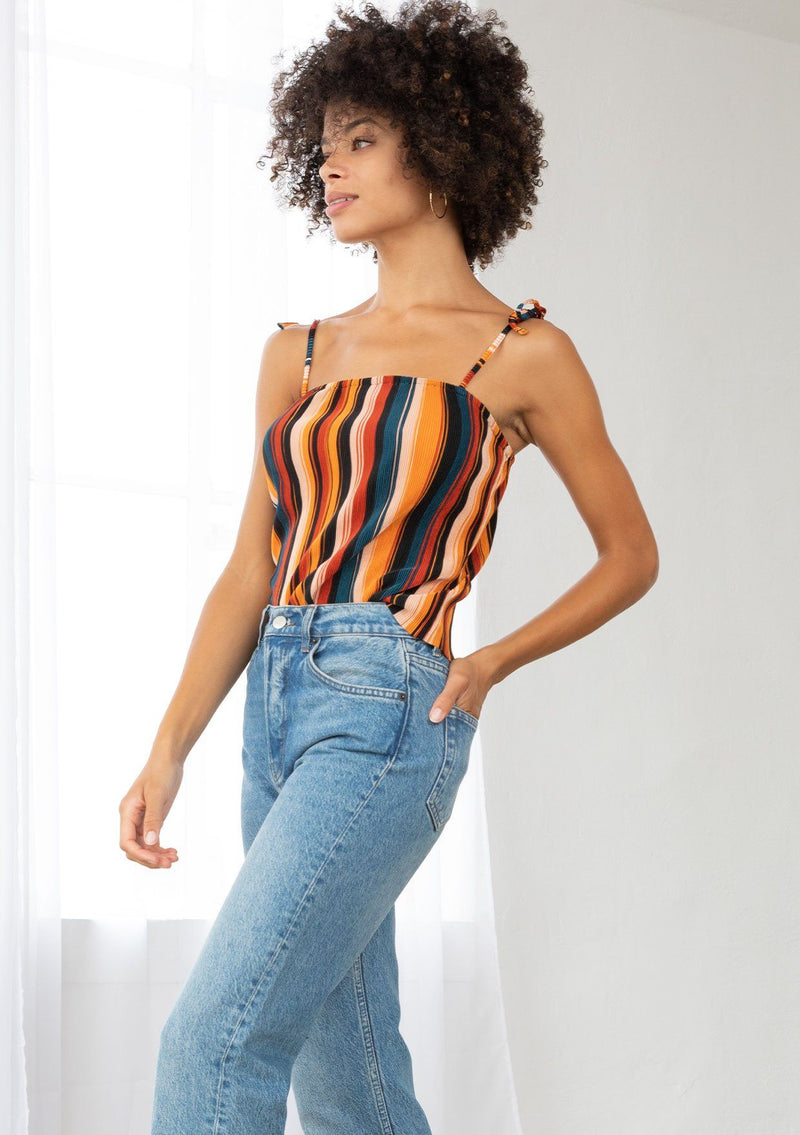 [Color: Black/Spice/Teal] A striped tie up tank top. The tie shoulder spaghetti straps and multicolor stripes add a retro feel to this cool and effortless top.