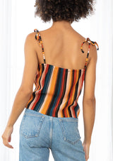 [Color: Black/Spice/Teal] A striped tie up tank top. The tie shoulder spaghetti straps and multicolor stripes add a retro feel to this cool and effortless top.