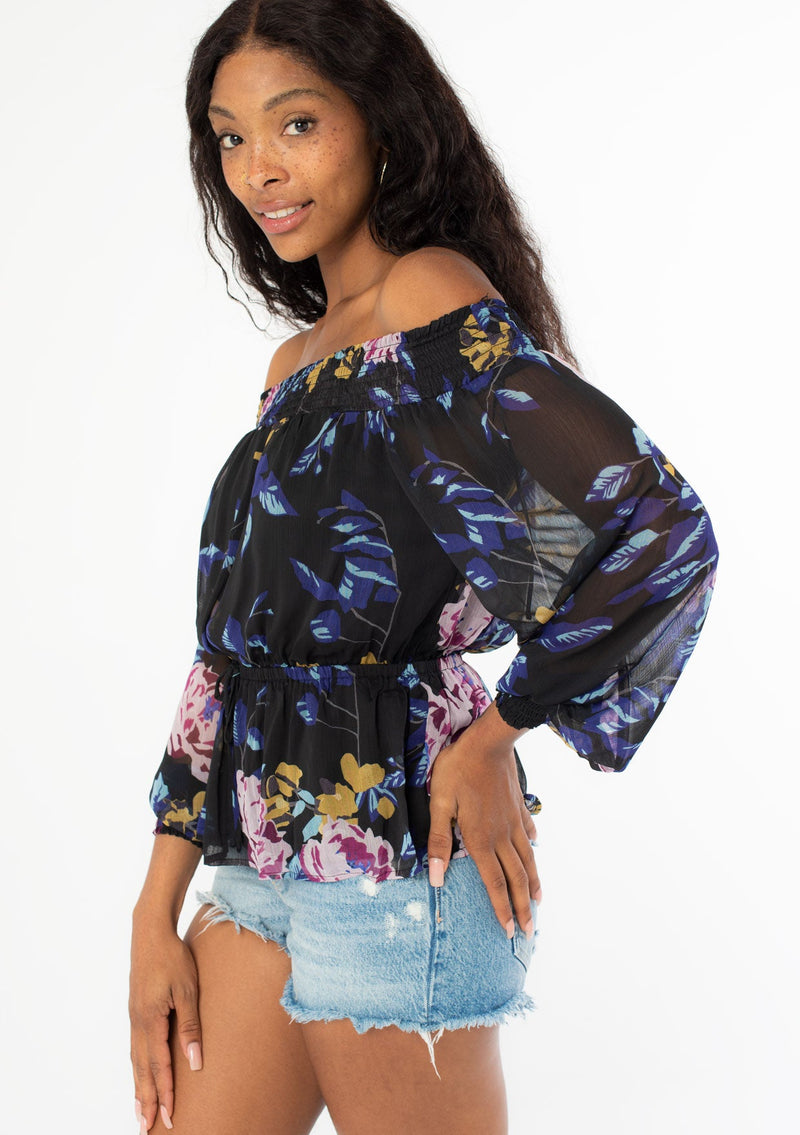[Color: Black Royal] Stop and smell the roses in our gorgeous floral print off shoulder blouse. Featuring a flattering voluminous long sleeve, a smocked elastic neckline, and a waist defining tie front. A bohemian take on Fall style that pairs effortlessly with denim.