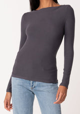[Color: Charcoal] A close up front facing image of a brunette model wearing a charcoal grey bamboo micro ribbed long sleeve tee. Featuring a mock neckline and a stretchy slim fit.