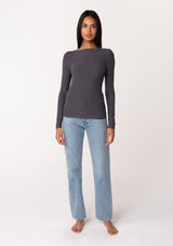 [Color: Charcoal] A full body front facing image of a brunette model wearing a charcoal grey bamboo micro ribbed long sleeve tee. Featuring a mock neckline and a stretchy slim fit.