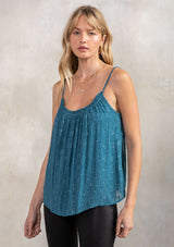 [Color: Teal] A model wearing a holiday teal chiffon camisole with metallic accents. With a ruffled round neckline and adjustable spaghetti straps.