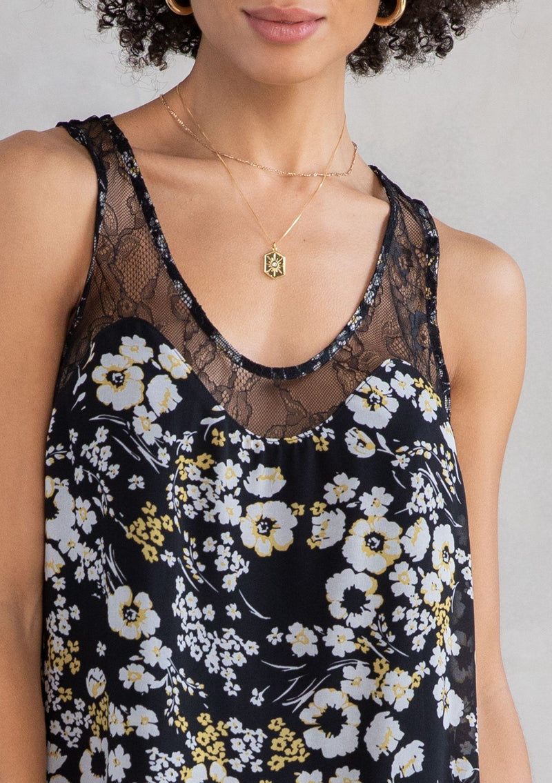 [Color: Black/Lemon] A model wearing a vintage inspired chiffon lace tank top in black and yellow floral print. With sheer lace yoke, straps, and hemline. 