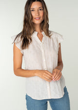 [Color: Oatmeal] A front facing image of a brunette model wearing a sheer cotton button front top in a striped jacquard. With short flutter sleeves and a ruffled neckline. A best selling bohemian top. 