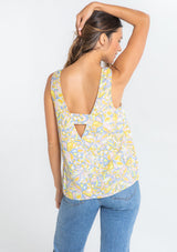 [Color: Blue/Lemon] A model wearing a blue and yellow vintage inspired retro floral print tank top. 